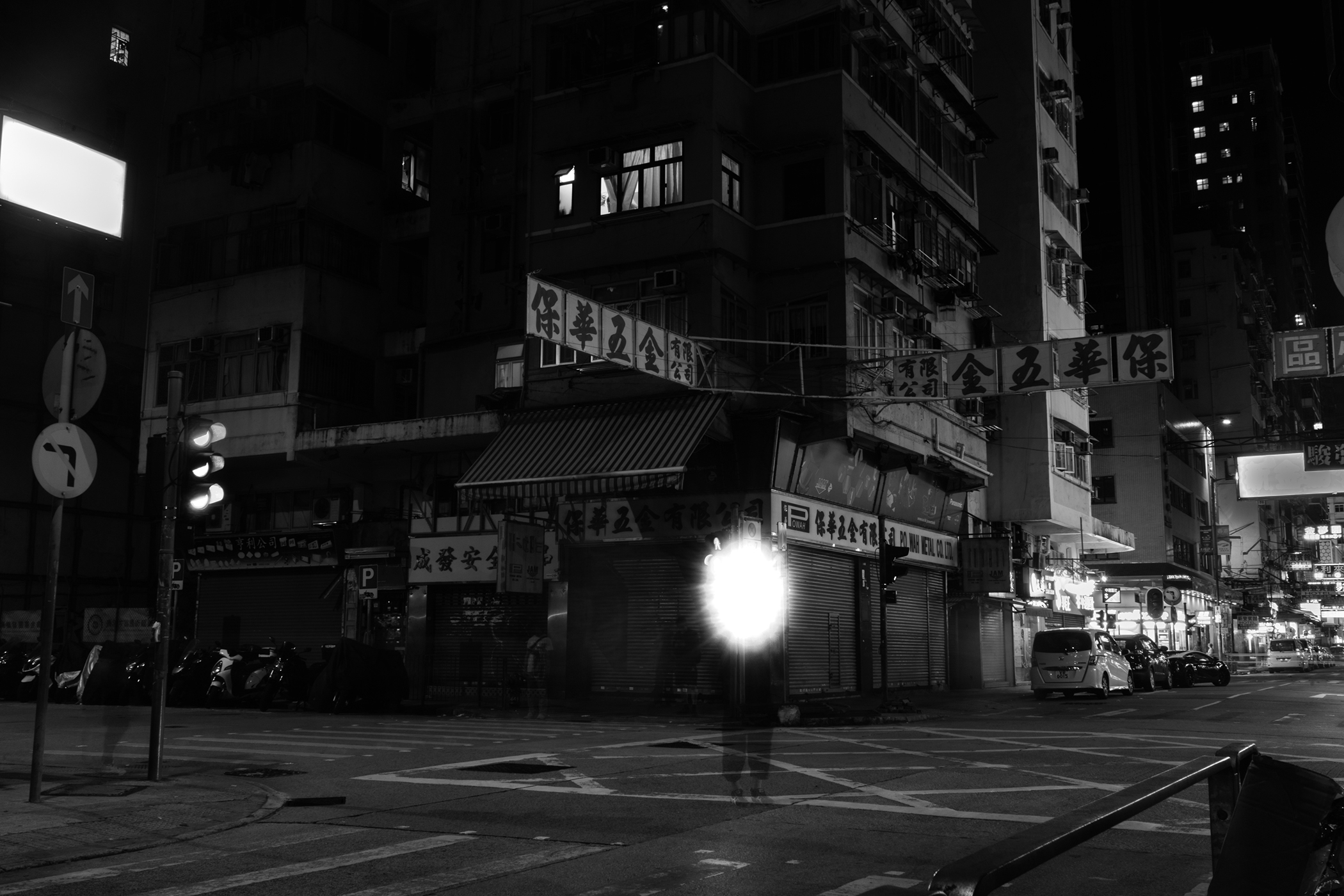 The Crossing (2019) – translucent figure amid empty Yau Ma Tei streets.