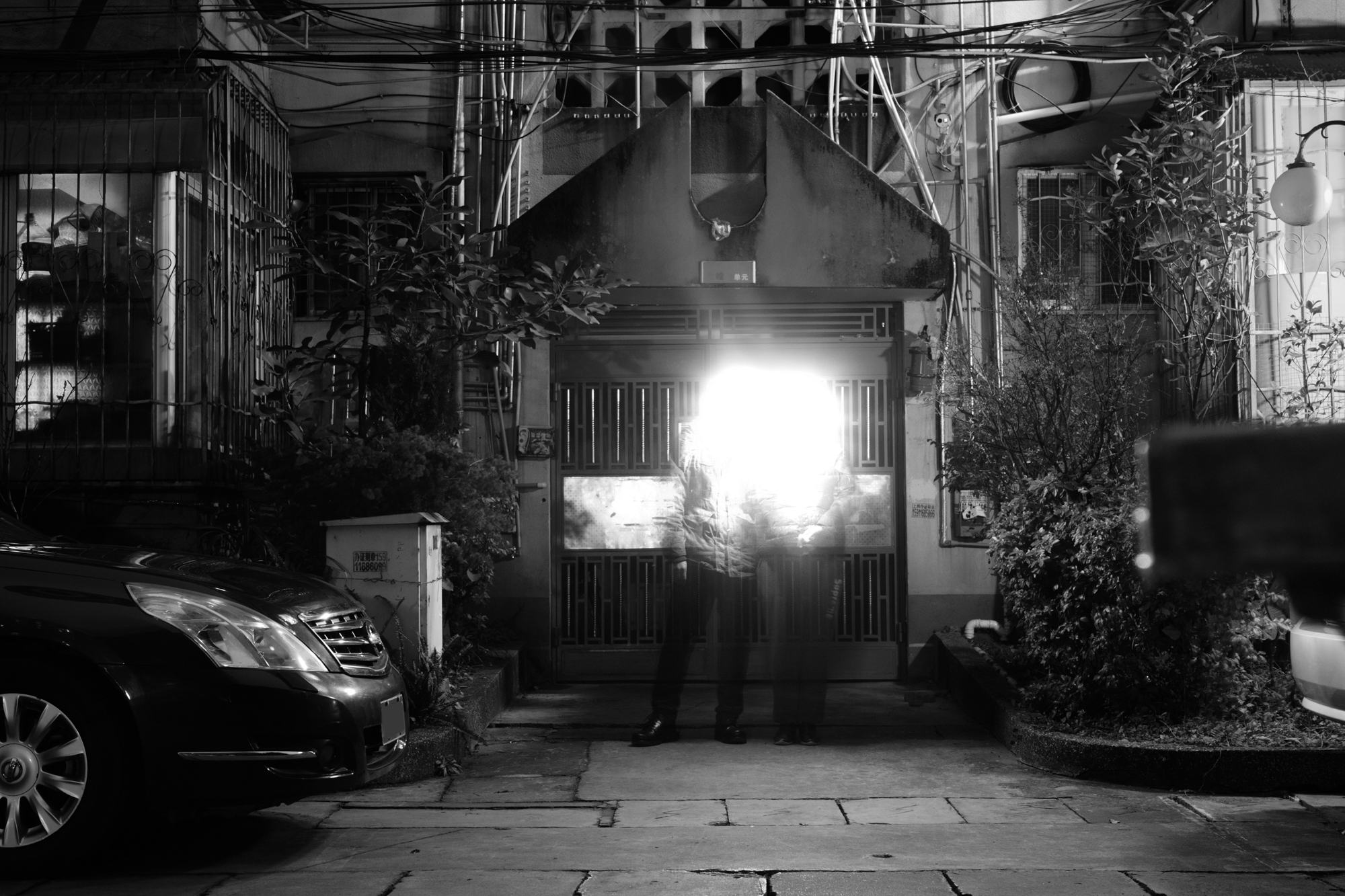 Home (2019) – glowing interior corridor with trailing light.